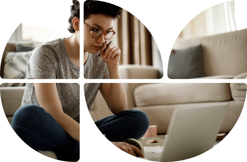 Frau sitzt nachdenklich am Laptop