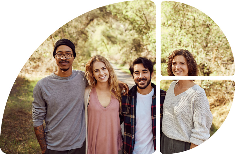 Vier Personen schauen gut gelaunt in die Kamera