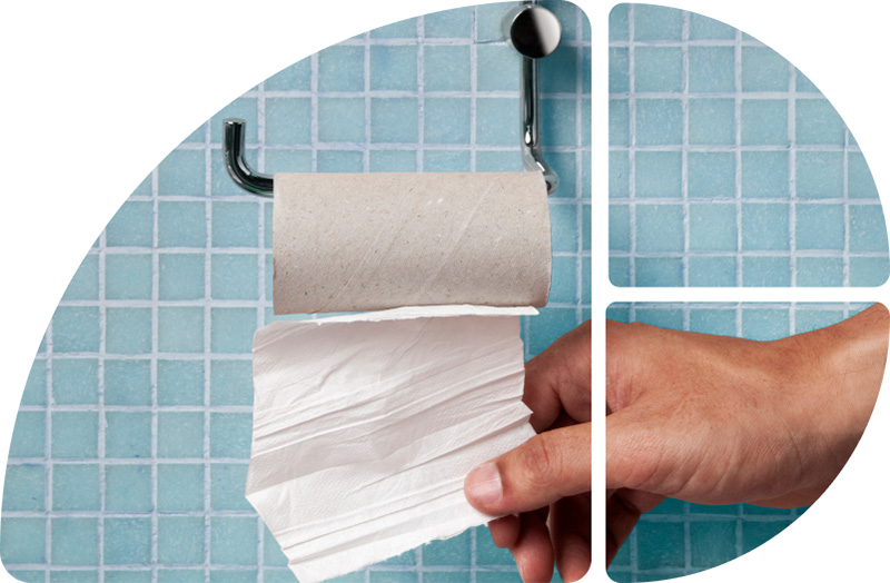 Hand greift zu Toilettenpapier