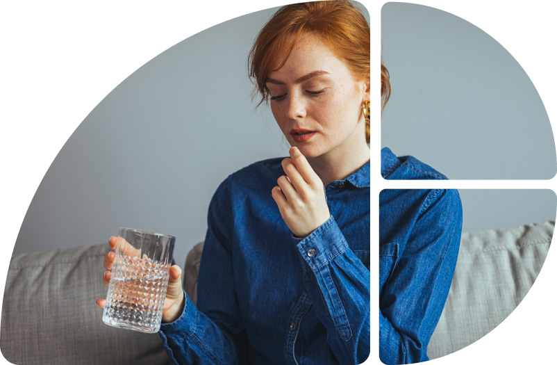 Frau nimmt eine Tablette ein 