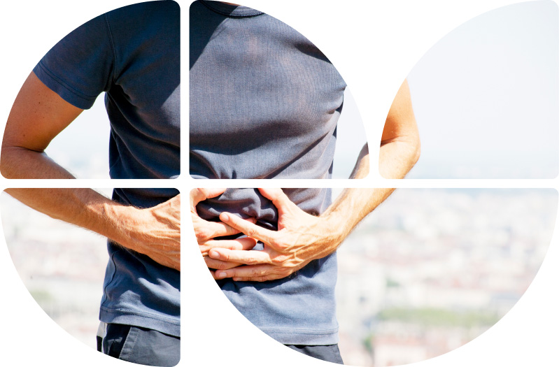 Mann hält sich den Bauch